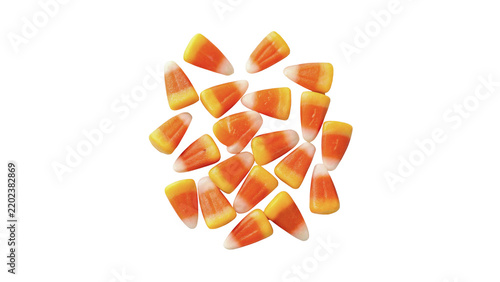 Scattered festive colorful halloween candy corn sweets layout isolated on transparent background