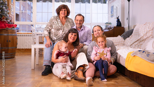 Multi-generational family celebrating christmas at home