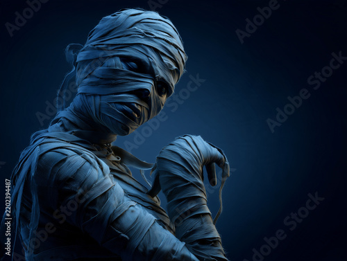 Dark 3D mummy character with detailed bandages in a dramatic blue Halloween scene