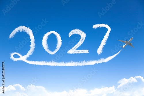 Happy New year 2027 concept. cloud drawing by airplane in sky