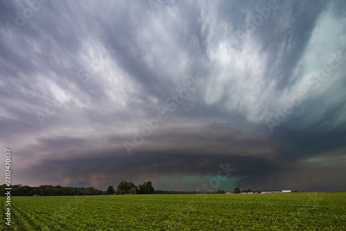 Cyclic Supercell storm cloud over green field near charleston