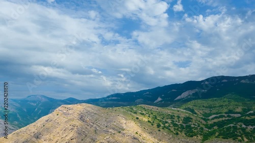 mountain valley under a dense cloudy sky time lapse scene