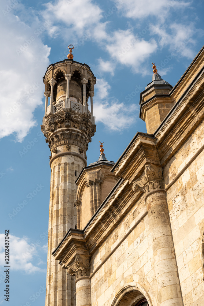 Fototapeta premium Aziziye Mosque minaret and historic stone facade in Konya Turkey