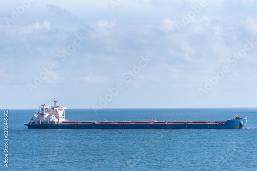Konstfotografi Large LNG-powered bulk carrier anchored at sea, with its LNG fuel tank clearly visible beside the ship's superstructure