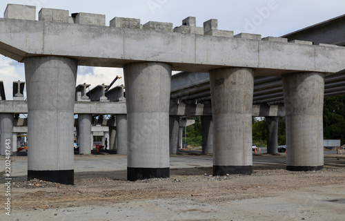 Construction of a two-level road interchange at Satpaev Avenue and Zhibek Zholy Street, with concrete flyovers and heavy equipment. Modern architecture. Ust-Kamenogorsk (Kazakhstan)