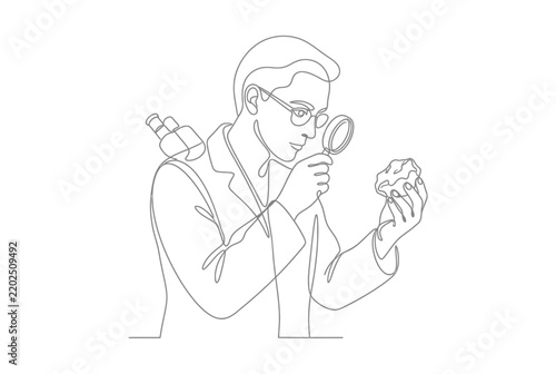 One line drawing of scientist examining rock with magnifying glass.