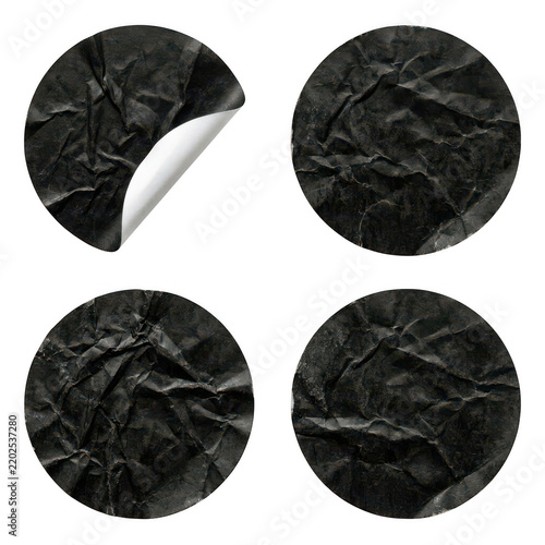 Set of four black crumpled paper stickers with a curled corner isolated on transparent background