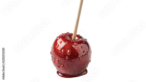 Sweet candy apple in red caramel glaze on wooden stick on transparent background