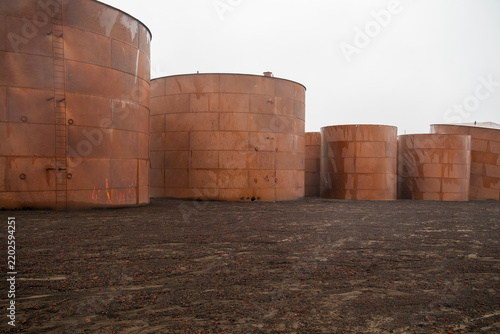 View of rusted oil storage tanks at Deception Island in Antarctica.