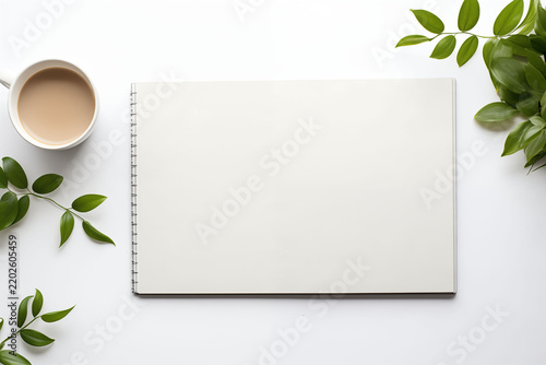 A flat-lay, high-angle shot of a clean, modern, and minimalist workspace.