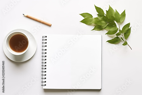 A flat-lay, high-angle shot of a clean, modern, and minimalist workspace.