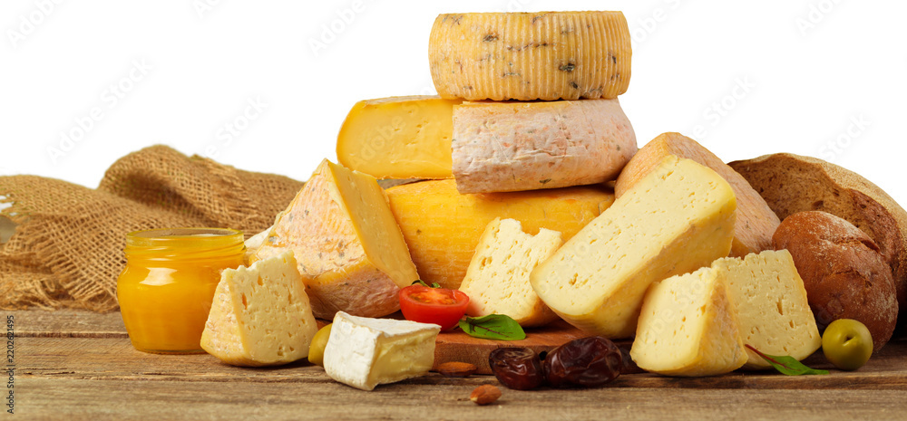 Fototapeta premium Assortment of cheeses, breads, and honey on wooden table with rustic cloth