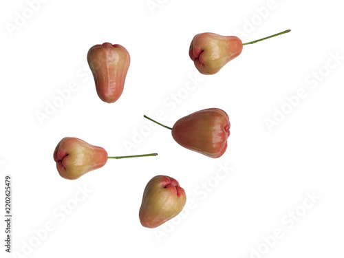 Fresh and colorful rose apples fruits isolated flying in air  