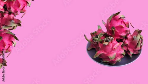 Healthy fresh fruits beautifully displayed in a bowl on simple pink background 