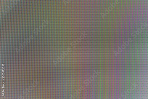RGB led screen matrix close up with colorful red green blue subpixel blocks. Technical display grid
