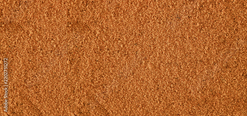 Red cane sugar texture background for organic baking recipe display