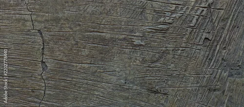 Panel kuchenny z motywem Close-up view of a rough, grey cement floor surface featuring deep, brushed horizontal grooves and scratches. This abstract, industrial-style concrete texture is perfect for grunge backgrounds