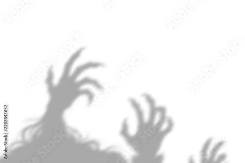 Obraz na plátně A dramatic shadowy depiction of clawed hands reaching upwards evokes feelings of