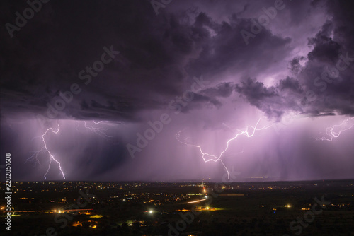 Lightning striking over sierra vista under stormy skies at night