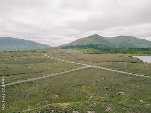 Obraz na plátně Aerial view of Lough Bofin in the Connemara region of County Galway, Ireland, surrounded by rugged mountains, green countryside and tranquil waters Galway, Ireland - 28 August 2026