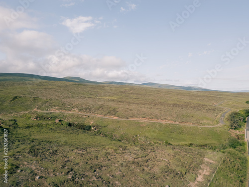 Obraz na plátně Aerial view of Lough Bofin in the Connemara region of County Galway, Ireland, surrounded by rugged mountains, green countryside and tranquil waters Galway, Ireland - 28 August 2026