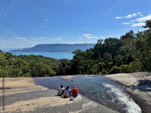 Mountain summit landscape and Veloso Waterfall in Ilhabela, Brazil.