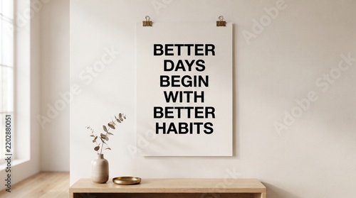 Minimalist wall poster with motivational quote hanging above a wooden console table in a bright room