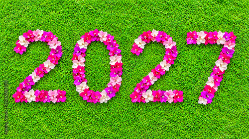 2027 floral number design with vibrant pink and white flowers on lush green grass | 2027 new year 