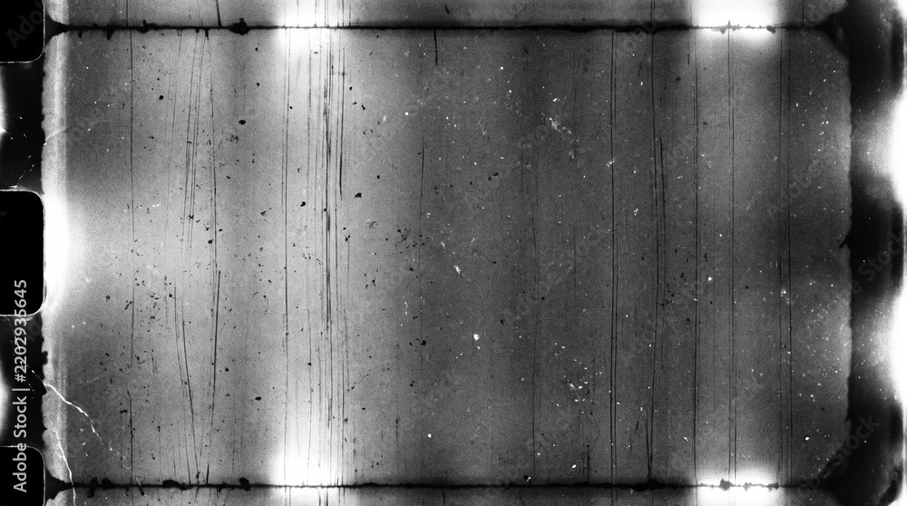 Fototapeta premium Old film texture with scratches, noise and light leaks. Realistic transparent overlay film texture in black-white, dust and grain. Distressed retro movie or photo negative effect of cinema nostalgia
