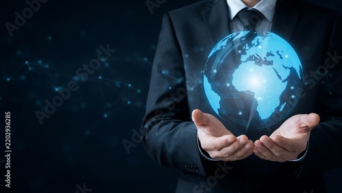 Businessman holding digital globe representing global connectivity, technology and international business