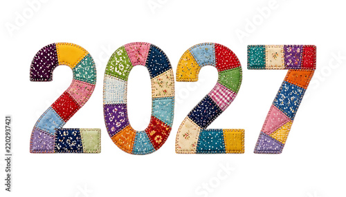 Colorful patchwork quilt style numbers representing the year 2027 isolated on a solid black background