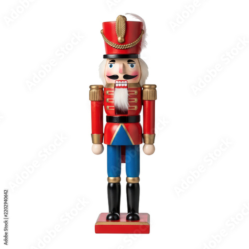 Traditional wooden nutcracker soldier in red uniform and blue pants.