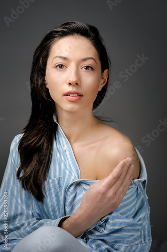 Sensual portrait of a beautiful woman with natural makeup looking at the camera
