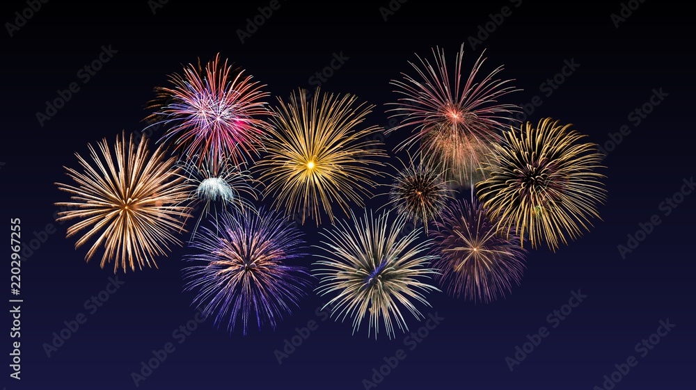 Fototapeta premium Fireworks of various colors and shapes burst in night sky