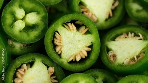 Macro view chopped Green jalapeno pepper, rotation
