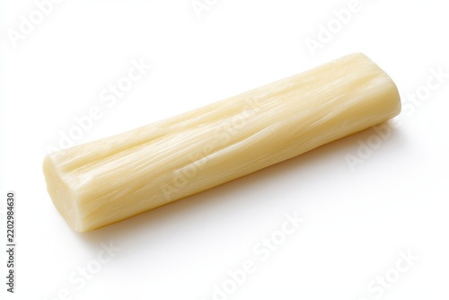Macro shot of chewy cheese string with glossy texture on white backdrop