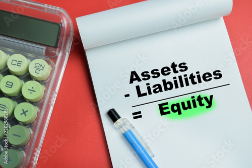 Concept of assets minus liabilities equals equity write on book isolated on table. For accounting equation and financial