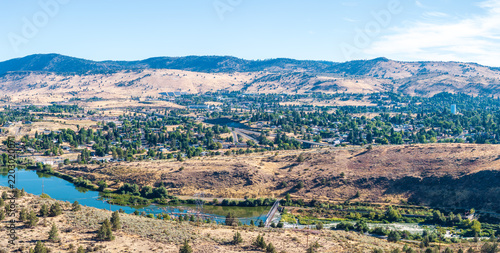 Aerial perspective of Klamath Falls, Oregon, showcasing the Link River winding through the valley with surrounding hills and the city.