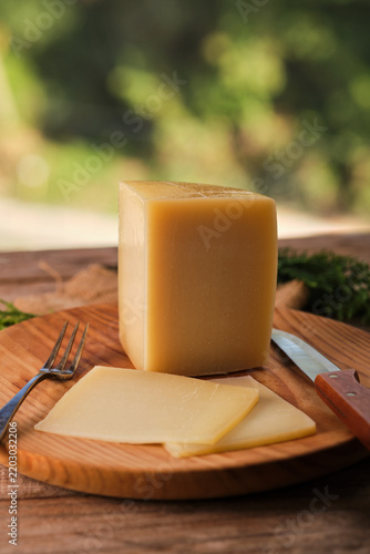 Spanish Aged Cheese With Idiazabal Designation on a Wooden Board