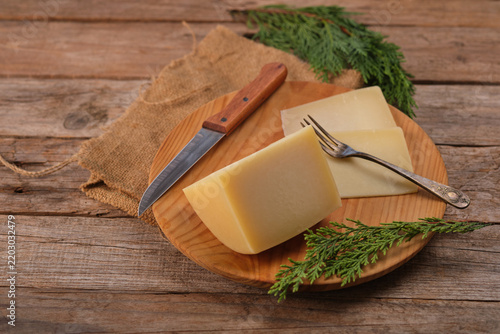 Spanish Aged Cheese With Idiazabal Designation on Wooden Plate