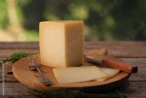 Spanish Aged Cheese With Idiazabal Designation on a Wooden Board