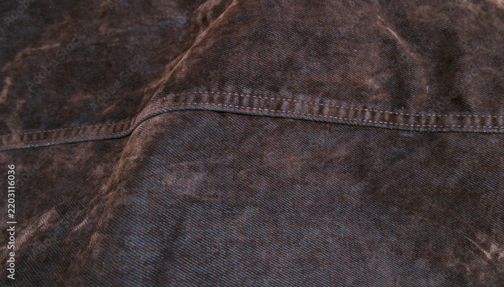 Obraz premium Dark washed denim fabric texture with stitching