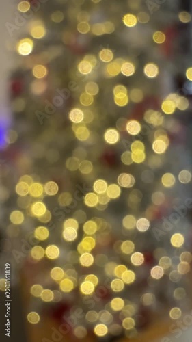 Golden Christmas tree lights in soft bokeh
