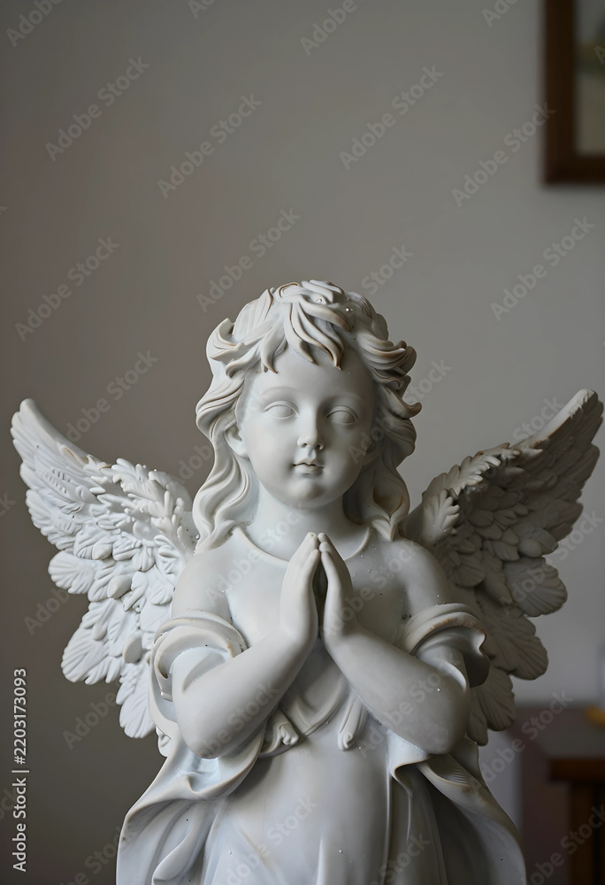 Fototapeta premium Spirituality and faith marble angel statue with hands in prayer religious devotion and peace memorial sculpture for funeral or cemetery decoration