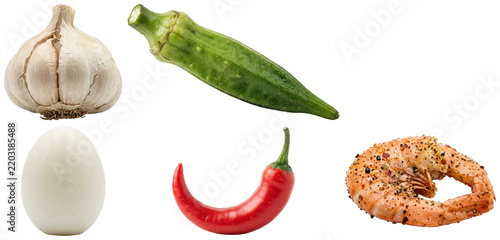 Fotografie A collection of classic Louisiana seafood boil ingredients including shrimp, okra, egg, garlic, and chili pepper