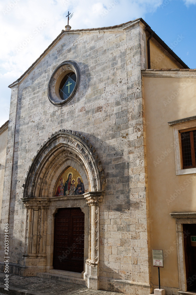 Obraz premium Facade of the Collegiate Church of Saints Leonard and Cassian in San Casciano dei Bagni, a historic Tuscan village in the province of Siena, Italy.