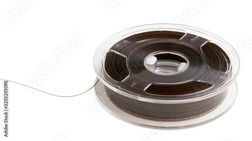 Canvastavla Isolated retro magnetic tape reel with brown recording film unwinding from clear