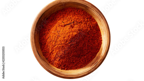 Isolated wooden bowl filled with vibrant red paprika spice, top view, aromatic culinary ingredient