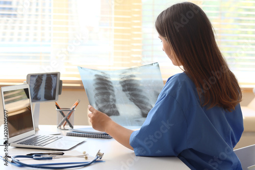 Medical diagnosis and healthcare analysis, doctor examining chest x-ray film ...