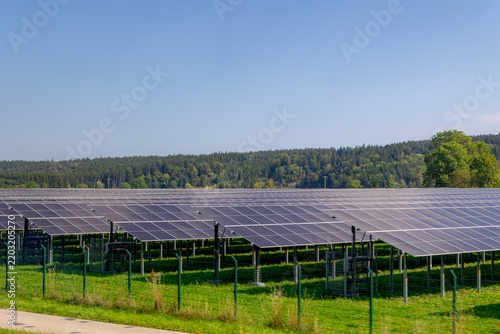 Green energy, Field of solar cell panels in countryside with mountain, Photovoltaic cell is an electrical device that converts the energy of light directly into electricity by the photovoltaic effect.